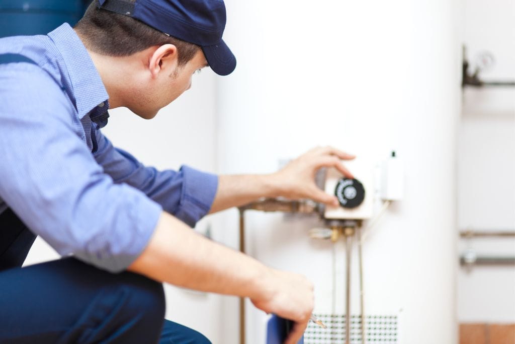 Professional plumber installing Electric Water Heater Installation
