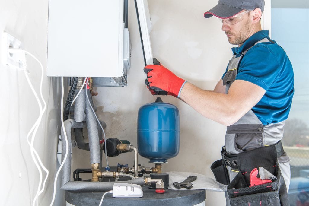 plumber installing Gas Water Heater Installation