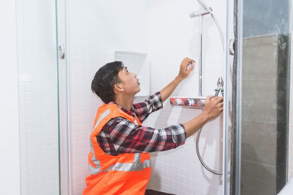 plumber installing shower